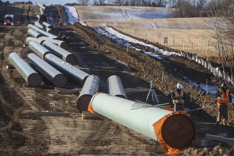 A pipeline under construction near a field in Alberta.