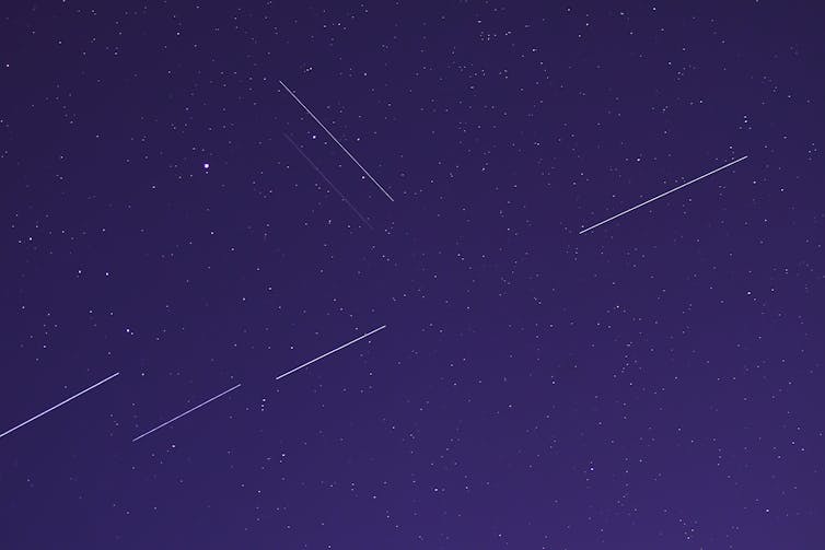 Satellites leaving streaks in the night sky.