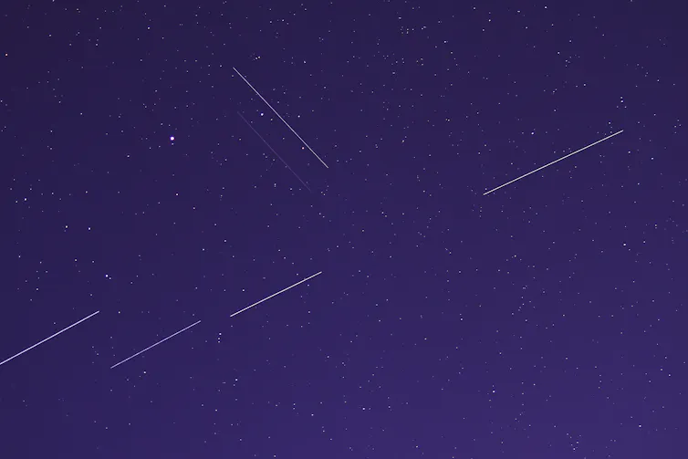 Satellites leaving streaks in the night sky.