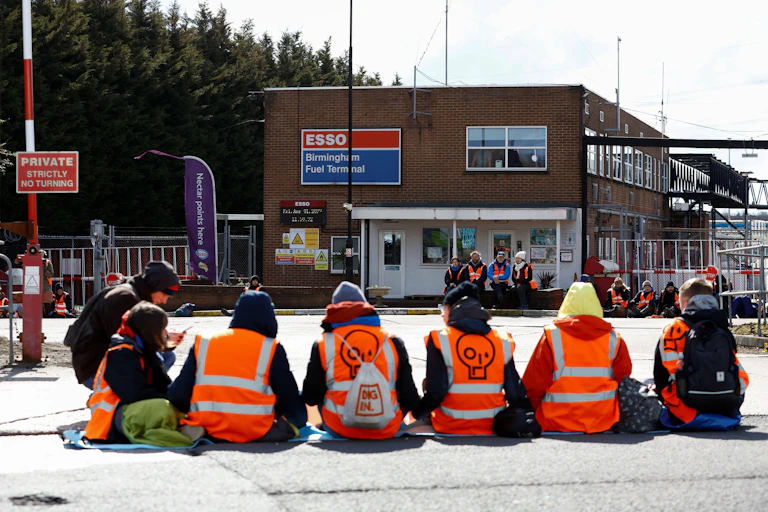 Protesters in front of an Esso oil building