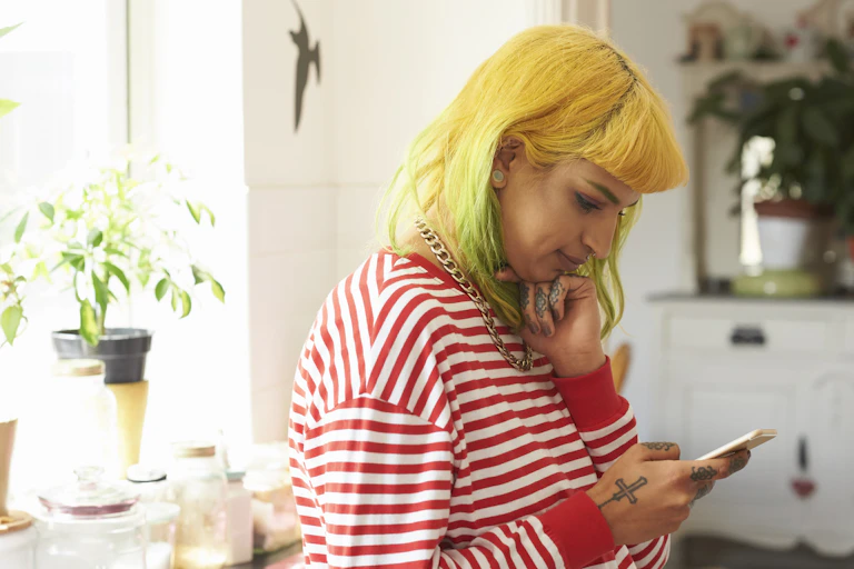 woman pondering her phone