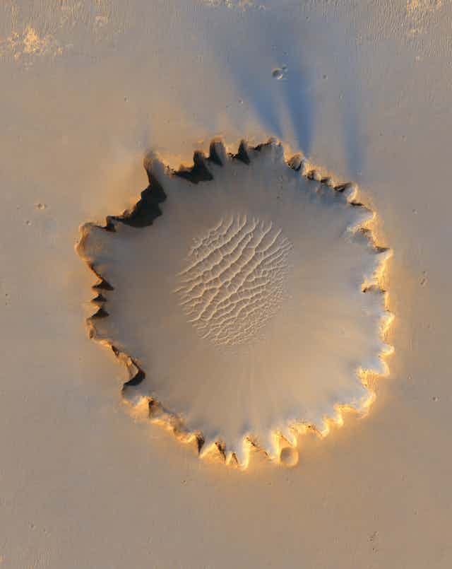 Sand blow in a crater on Mars