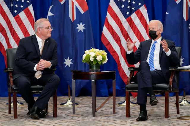 Australian PM Scott Morrison talking to US President Biden during a diplomatic engagement