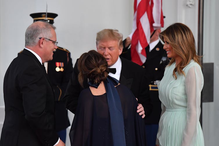 Australian PM Scott Morrison and his wife standing alongside US President Donald Trump at a state dinner in Washington D.C.