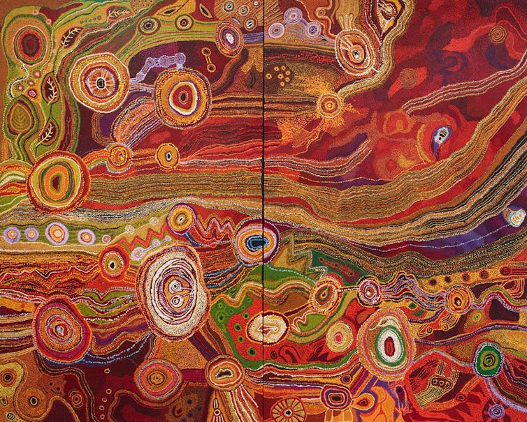 A sweeping Indigenous landscape painting in reds, greens and purples