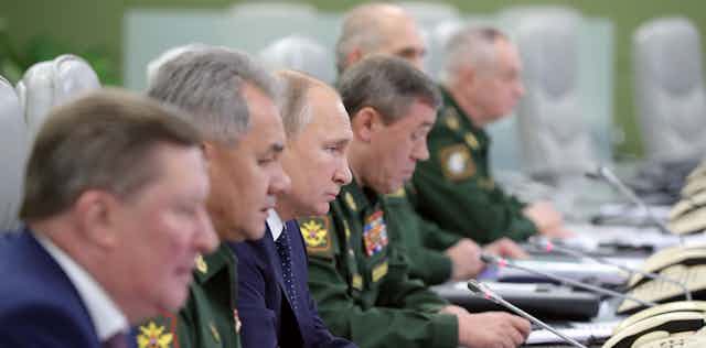 Vladimir Putin with senior military officers.