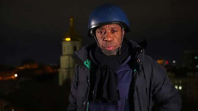 BBC reporter Clive Myrie in protective clothing while reporting from Ukraine, March 2022.
