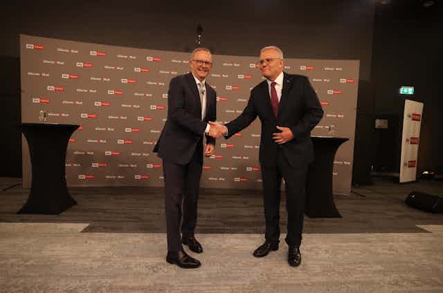 Labor leader Anthony Albanese shakes hands with Prime Minister Scott Morrison