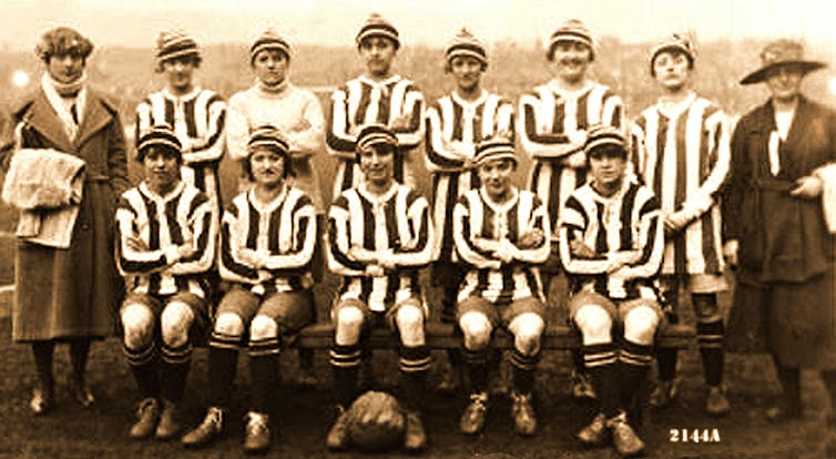 A women's team lined up wearing football strips.