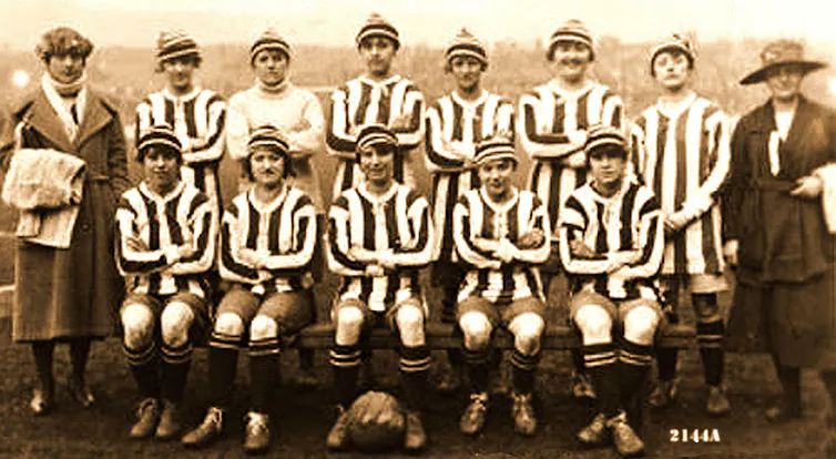 A women's team lined up wearing football strips.