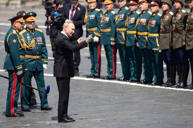Russian President Vladimir Putin addresses army officers at a parade in Red Square