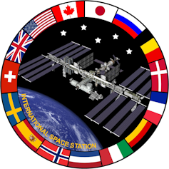 A logo of the ISS surrounded by the flags of all the countries that support it.