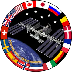 A logo of the ISS surrounded by the flags of all the countries that support it.
