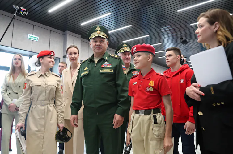 Russia's defence minister, Sergei Shoigu, with members of the Young Army Military Patriotic Movement.