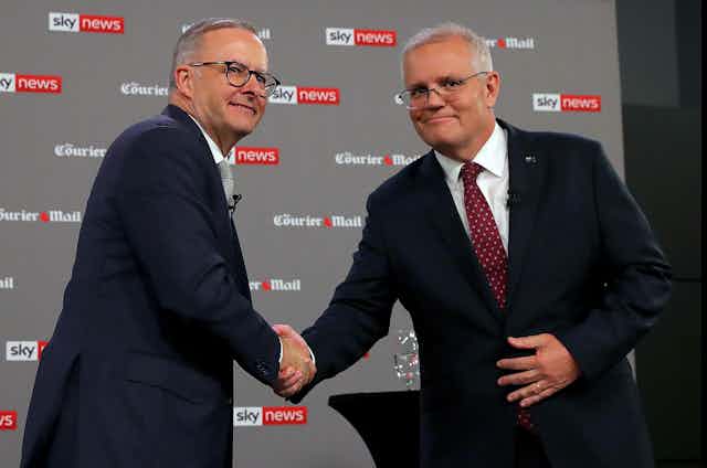 Anthony Albanese and Scott Morrison shake hands at their debate