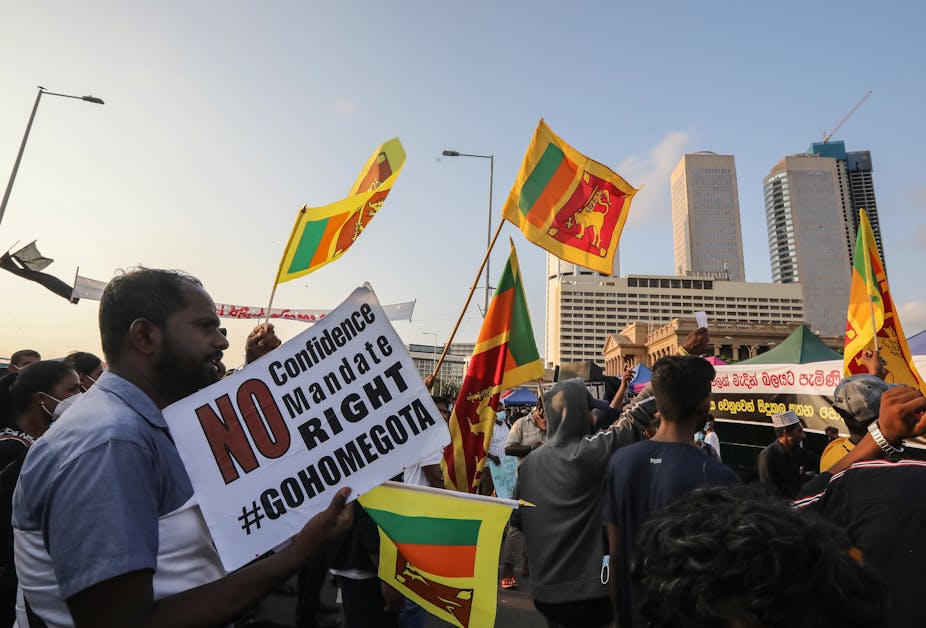 Protestors with flags and placards in Colombo