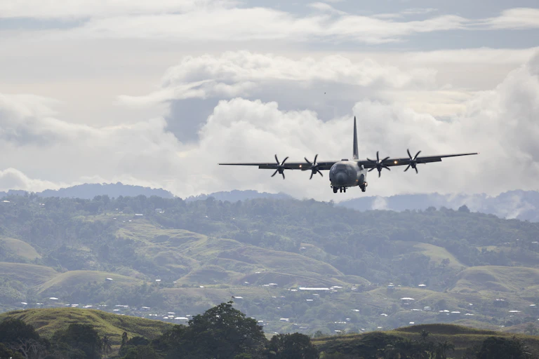 Royal Australian Air Force C-130 Hercules aircraft, preparing to land at Honiara International Airport, Solomon Islands
