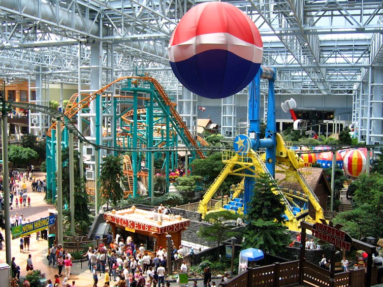 A large, multicoloured play area inside a glass building