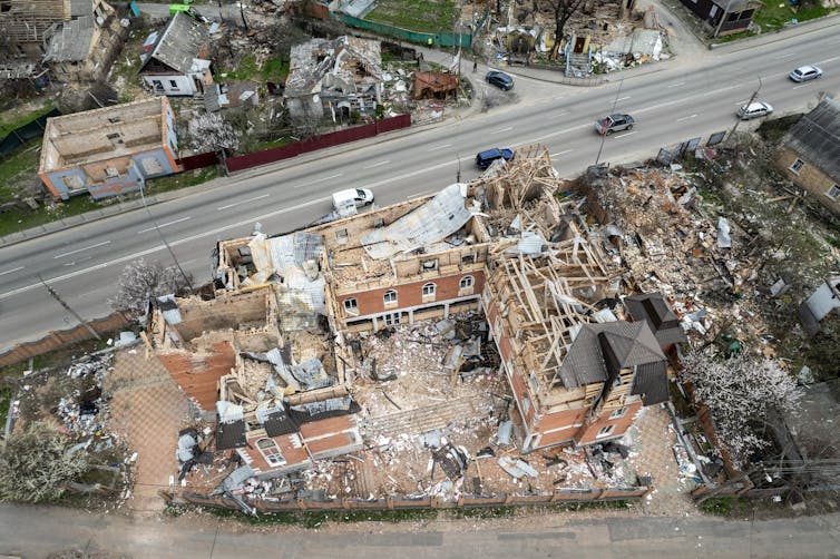 An aerial photograph showing the wrecked buildings in Gostomel, Ukraine.