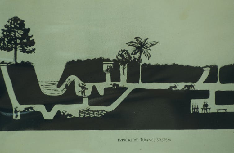 A drawing depicts men and women crawling along a tunnel structure in Vietnam