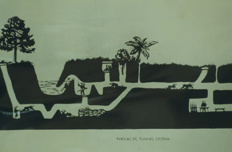 A drawing depicts men and women crawling along a tunnel structure in Vietnam