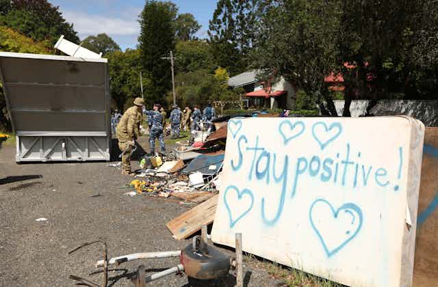 Sign during flood clean up that says 'stay positive'