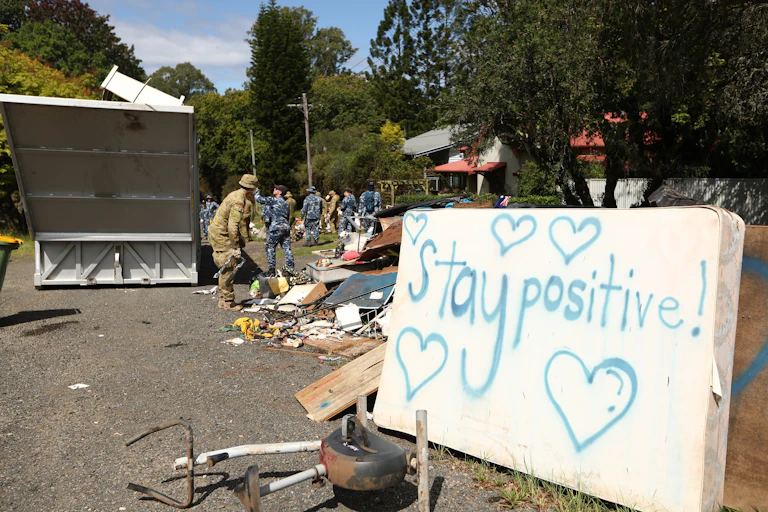 Sign during flood clean up that says 'stay positive'