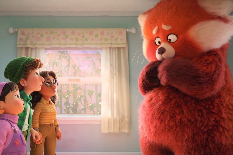 Turning Red image: three girls stare up at a giant red panda