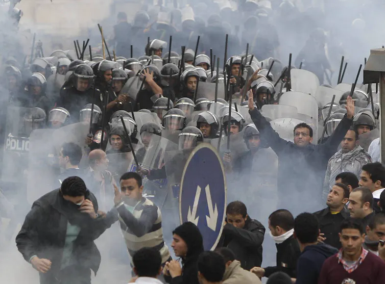 protesters clash riot police Egypt