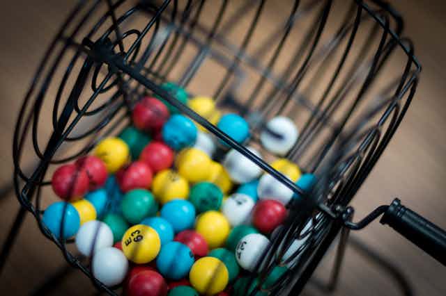 coloured and numbered balls in basket