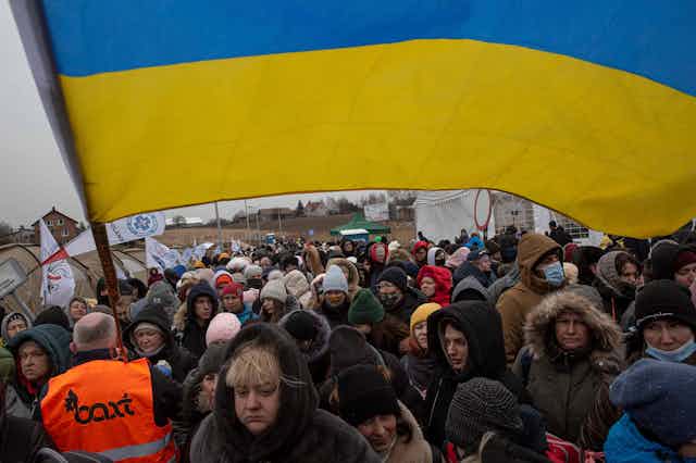 Refugees fleeing Ukraine into Poland