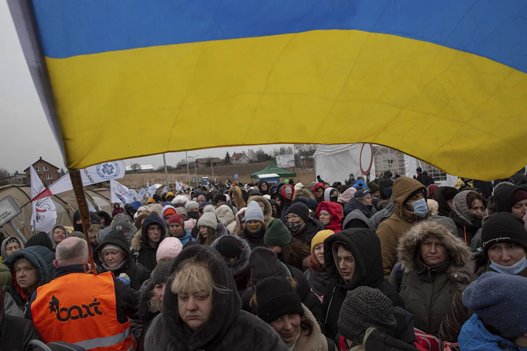 Refugees fleeing Ukraine into Poland