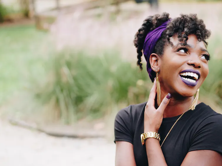 A black woman laughs