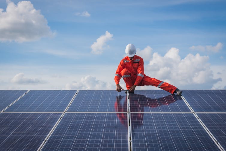 Man installing solar