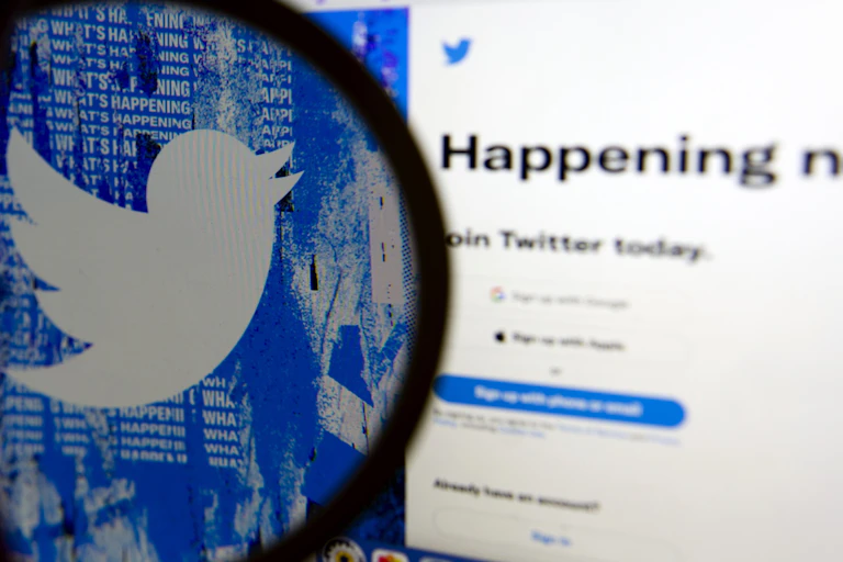 Twitter logo magnified on a screen