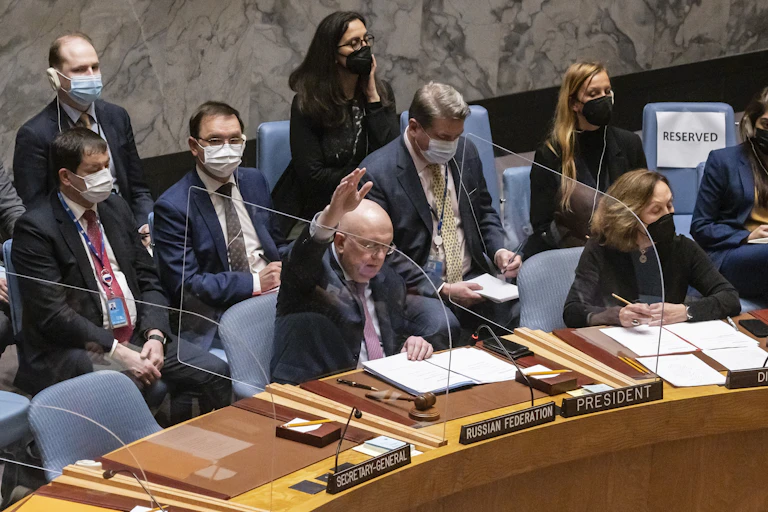 Russia’s Ambassador to UN Vassily Nebenzia raises his hand to veto a resolution dondemning Russia's invasion of Ukraine, February 25 2022.