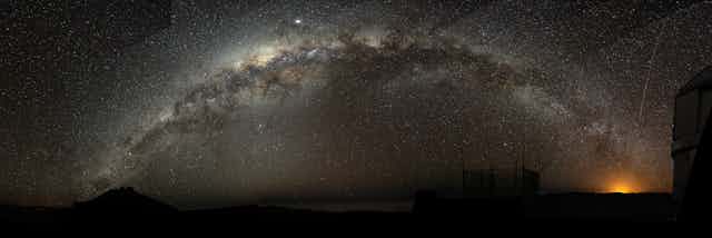 The Milky Way galaxy arching across a night sky.