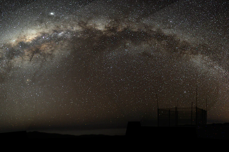 The Milky Way galaxy arching across a night sky.