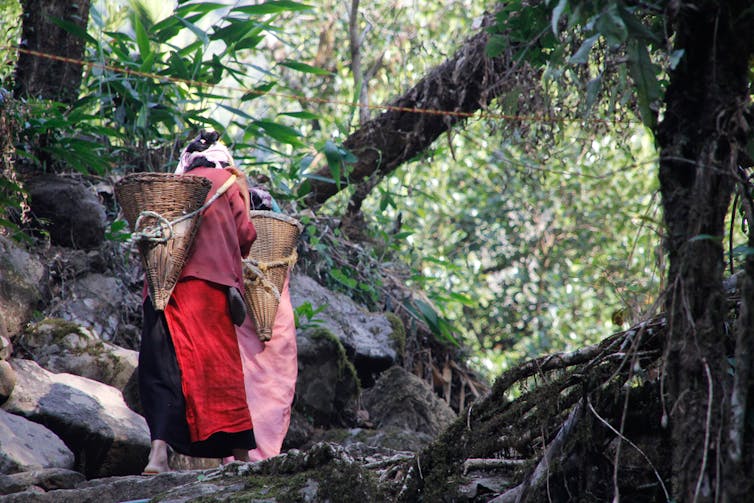 Khasi women carrying baskets.