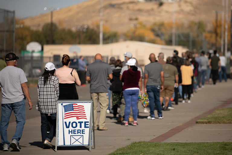 People standing in a line to vote.