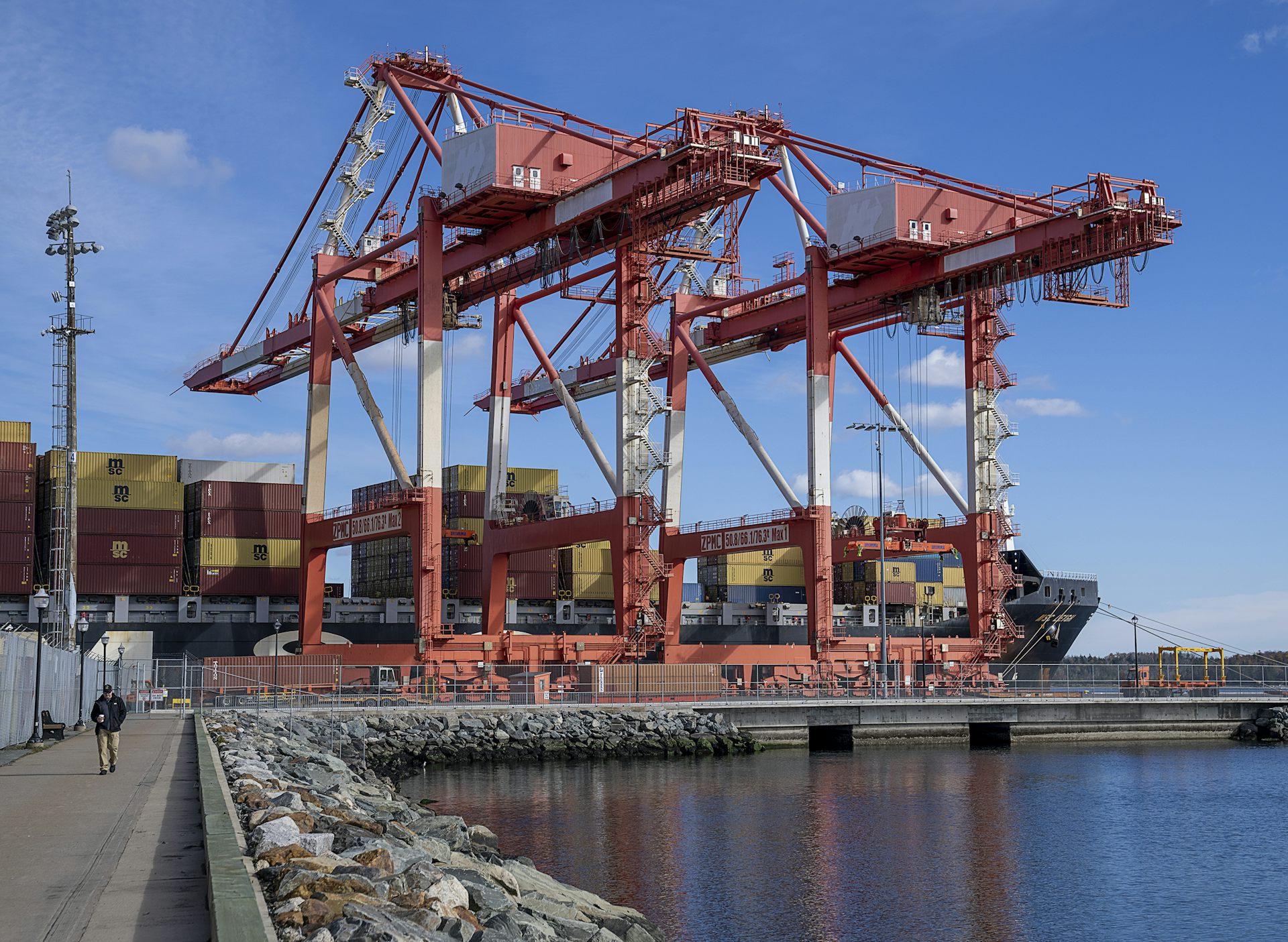 Shipping containers being loaded onto a cargo ship