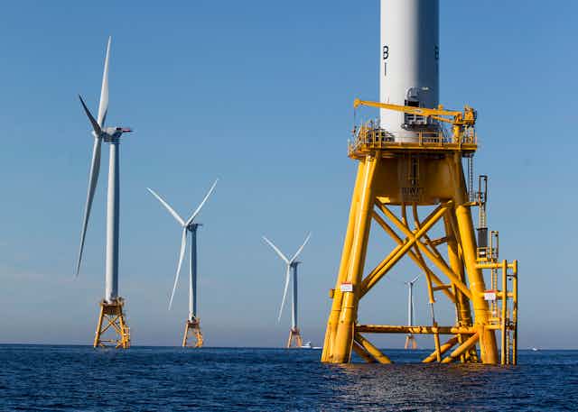 Five of the U.S. seven wind turbines, off Rhode Island