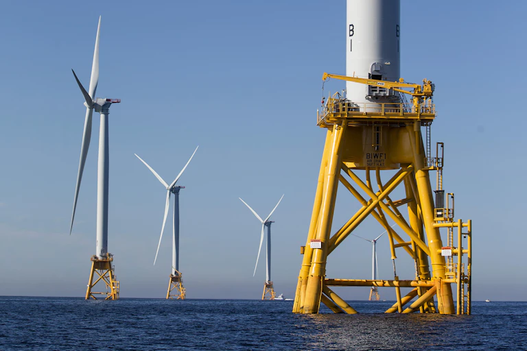 Five of the U.S. seven wind turbines, off Rhode Island