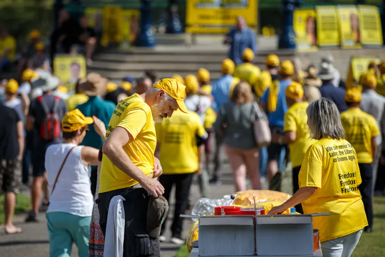 Voters wearing yellow campaign shirts attending a UAP event in Adelaide