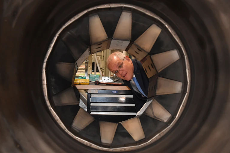 man looks through hole