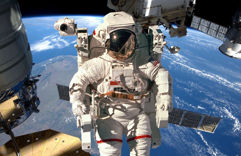 Astronaut in space outside the International Space Station.