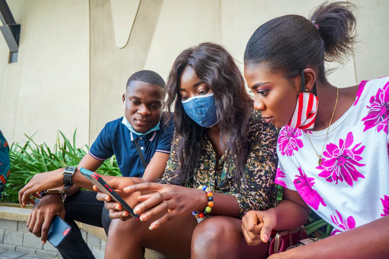 young people looking at cellphone