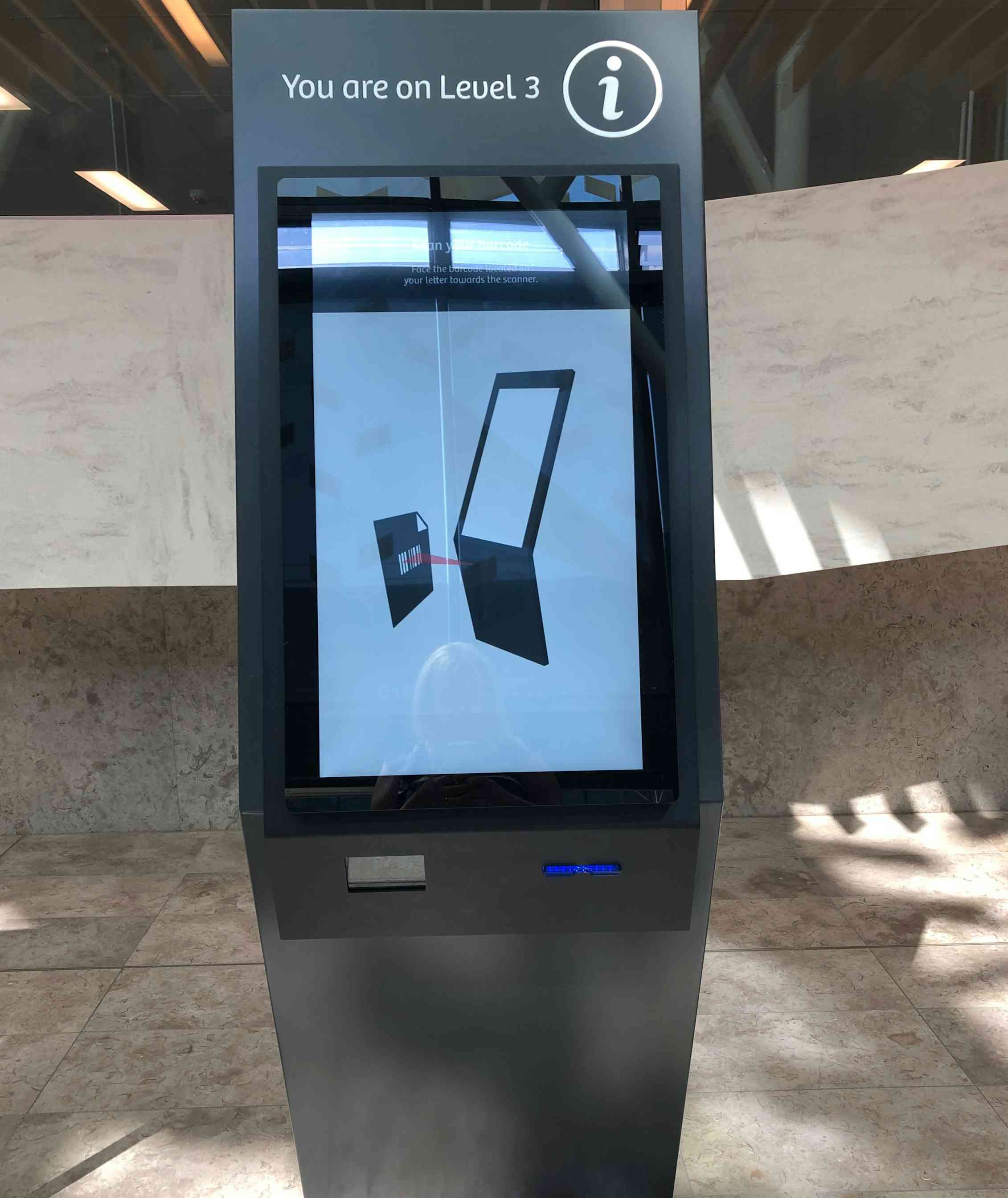 An electronic station that people can interact with to get directions or see maps is seen with the words 'you are on level 3.