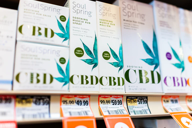 CBD products for muscle soreness sitting on a shelf