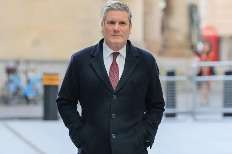 Keir Starmer walking in the street.